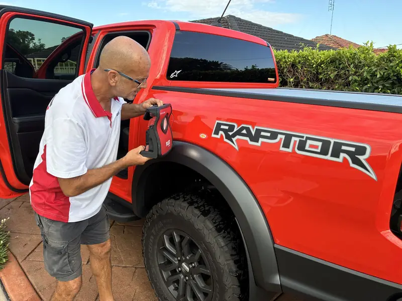Hand finishing the paint on a Ford Ranger Raptor